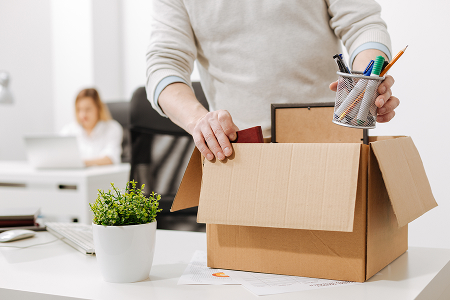 employee packing office equipment