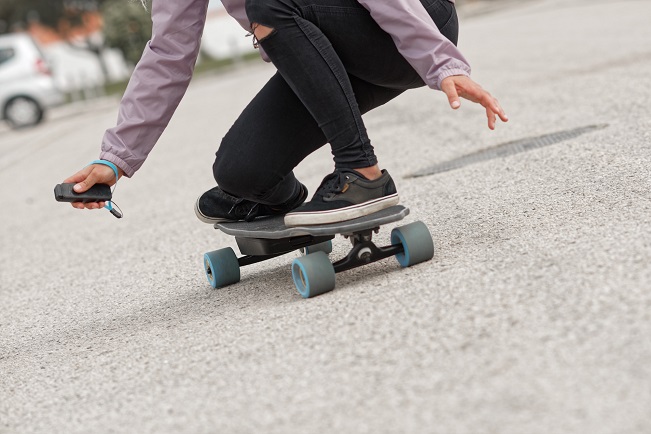 girl skating electric board
