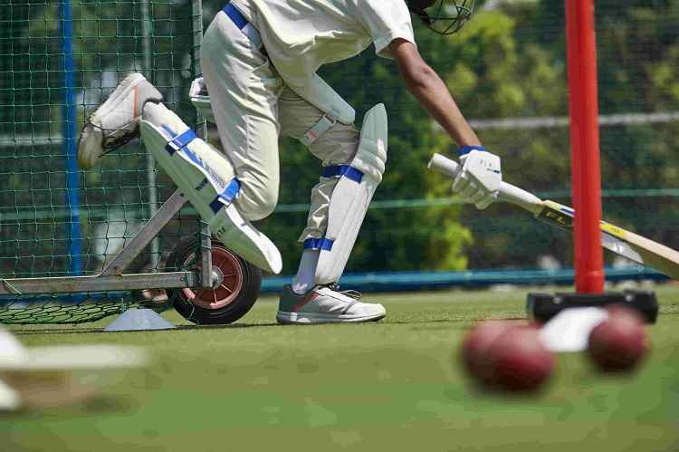 man wearing cricket pads 