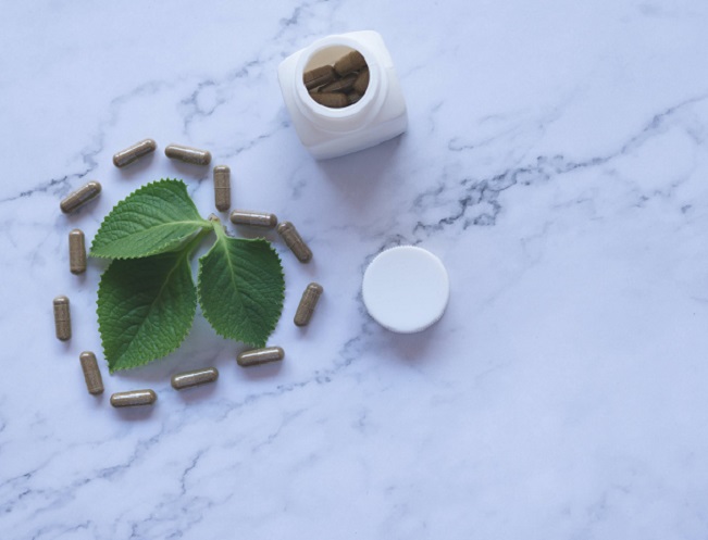 picture of bottle of vitamins on a marble background 