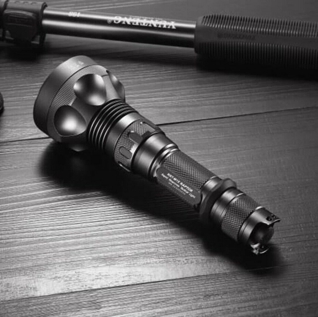 Photo of JetBeam RRT-M1X Raptor flashlight on wooden floor