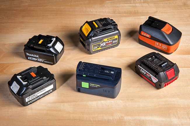 Close-up of 6 different batteries for power tools