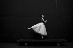 ballerina posing with ballet tutu with layers of tulle