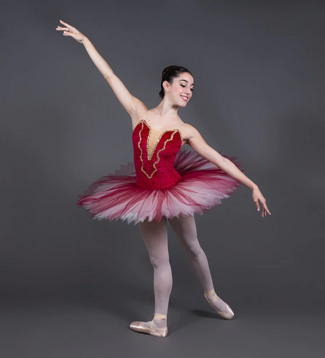 ballerina wearing red professional adult ballet tutu