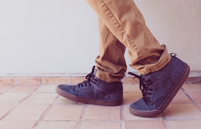 picture of a person walking in outdoor footwear on tiles