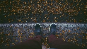 picture of person standing on stair wearing red pants and outdoor footwear