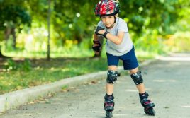 picture of a boy on insline skates in a park