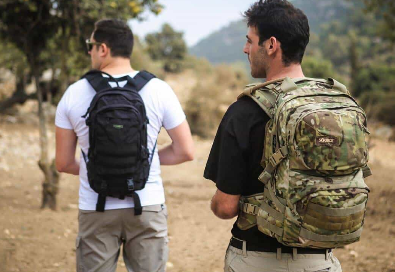 Two man wearing tactical backpacks