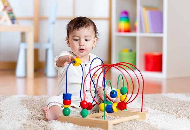 picture of toddler playing with educational toy