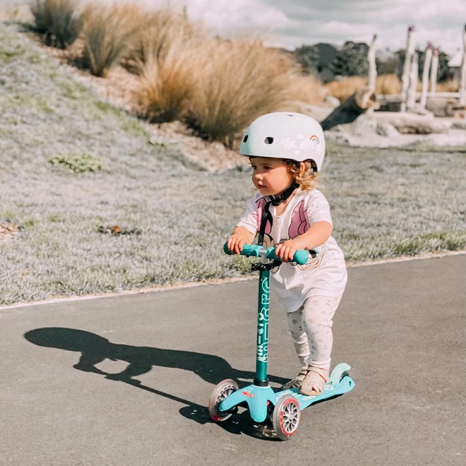 picture of a toddler riding a scooter